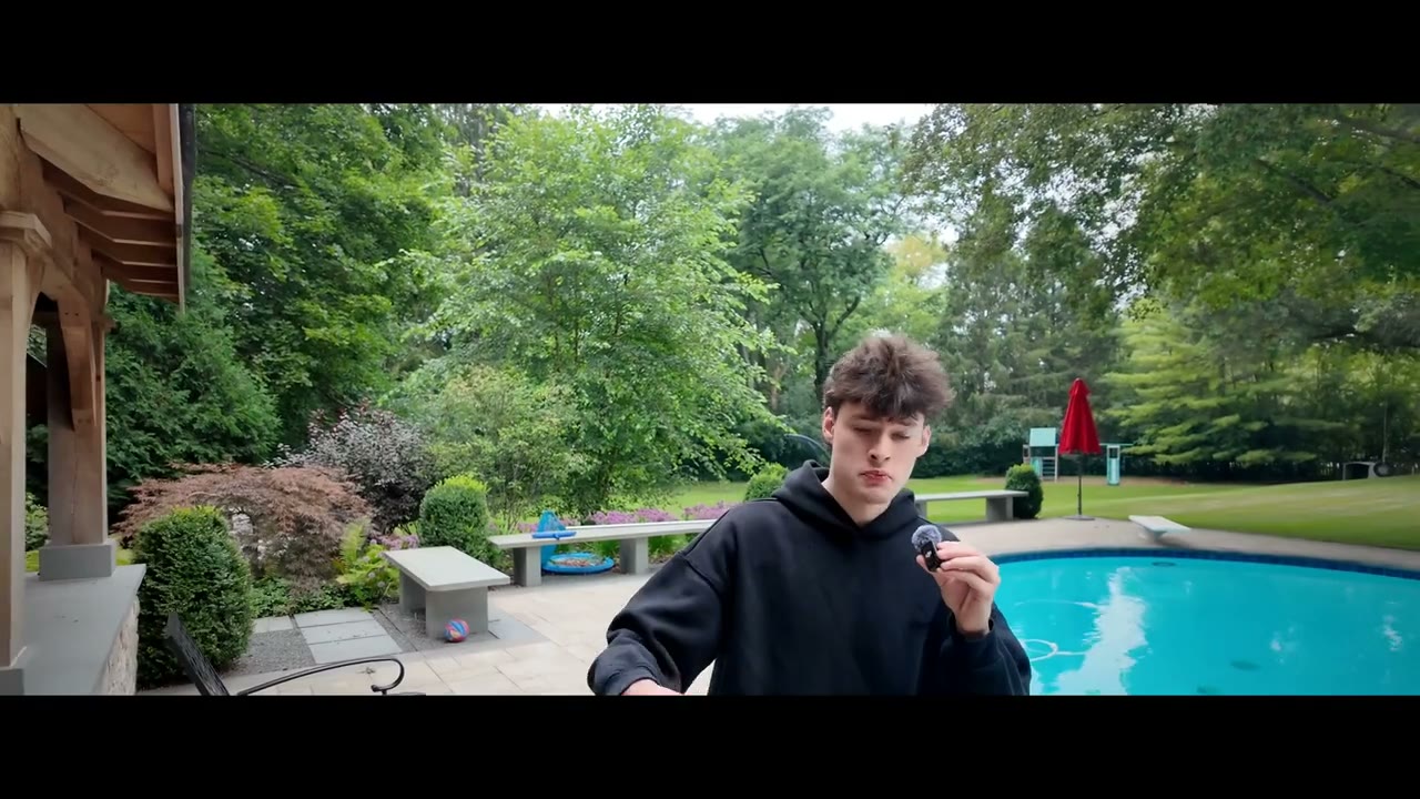 A frame from our co-founder’s walk-and-talk by a pool, edited in the Documentary style